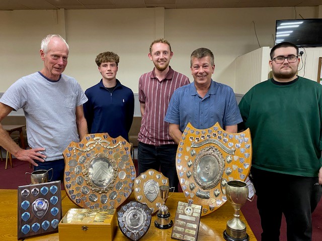 Kidderminster Chess Club members gathered with trophies from the 2025/26 season.