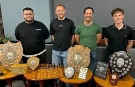Kidderminster Chess Club members with the season's trophies