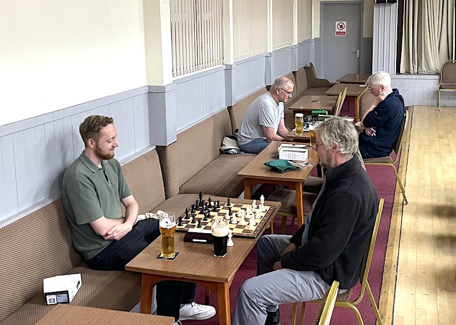 Two games in progress in a quieter corner of Kidderminster Harriers Social Club on club night
